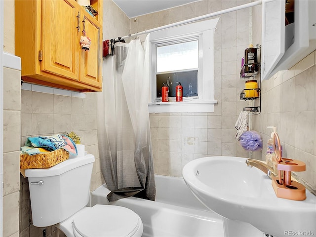 1561 Clinton St, Aurora, CO 80010 - bathroom featuring tile walls, shower / bath combination with curtain, and backsplash