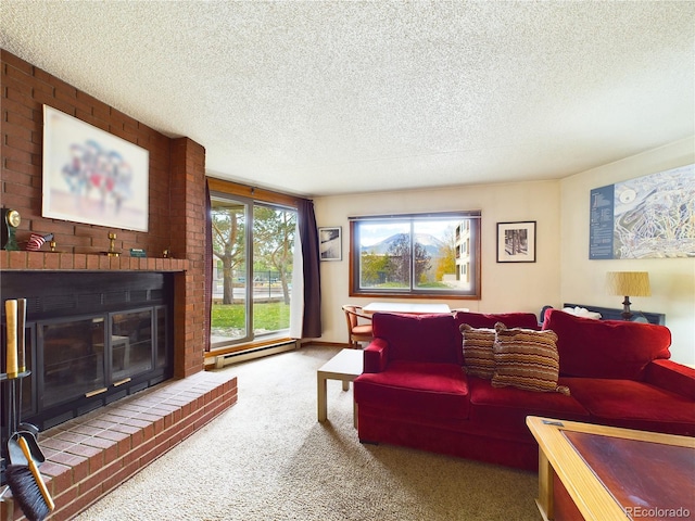 carpeted living room featuring a brick fireplace, baseboard heating, and a textured ceiling