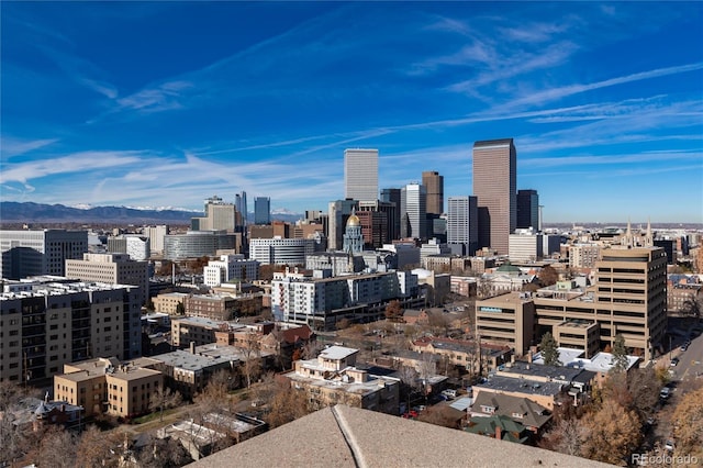 property's view of city with a mountain view