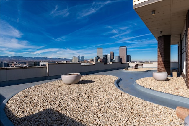 view of yard featuring a mountain view and a patio