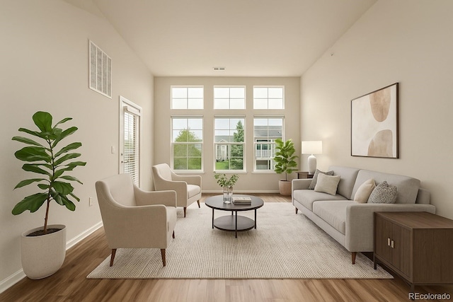 living area featuring wood finished floors and baseboards