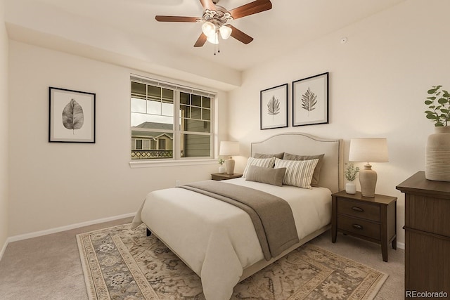 carpeted bedroom featuring baseboards and a ceiling fan