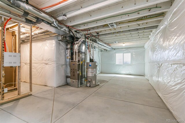 basement with heating unit and water heater