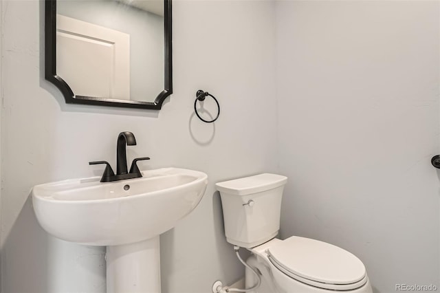 6000 Yarrow St, Arvada, CO 80004 - bathroom featuring a sink and toilet