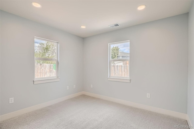 6000 Yarrow St, Arvada, CO 80004 - unfurnished room with plenty of natural light, light carpet, and visible vents