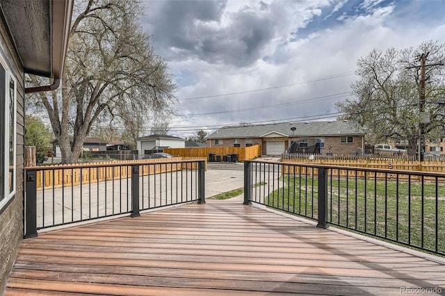 6000 Yarrow St, Arvada, CO 80004 - wooden deck with a fenced backyard, a lawn, and a residential view