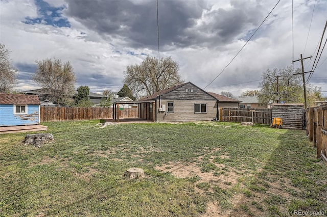 6000 Yarrow St, Arvada, CO 80004 - view of yard with a fenced backyard and an outbuilding