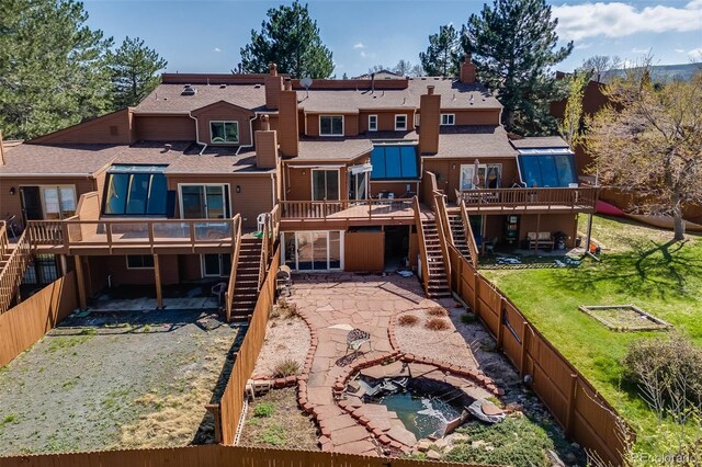 163 Ward Ct, Lakewood, CO 80228 - rear view of property with stairway, a wooden deck, a patio, and a shingled roof