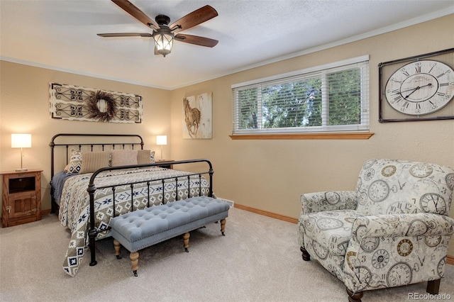 bedroom with crown molding, light colored carpet, and ceiling fan