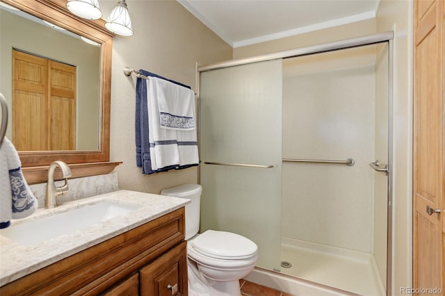 bathroom featuring crown molding, vanity, toilet, and a shower with shower door