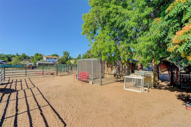 view of playground featuring an outbuilding