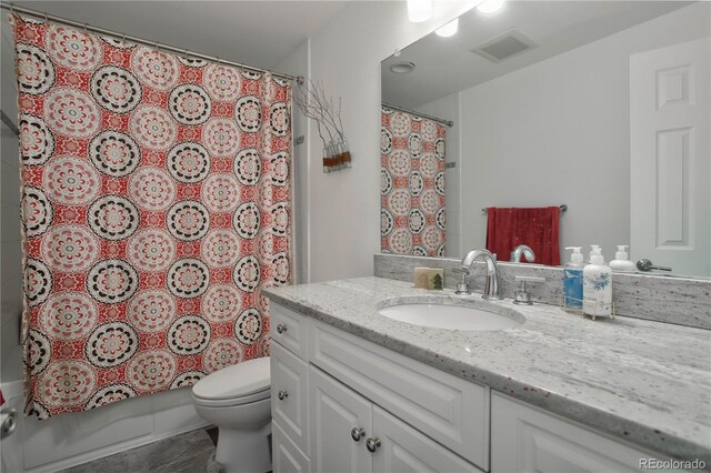 full bathroom featuring vanity, toilet, and shower / bath combo