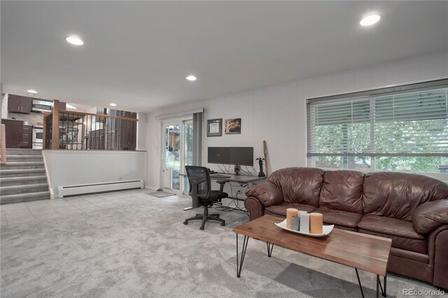 living room featuring a baseboard radiator and light colored carpet