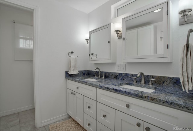 bathroom with tile patterned flooring and vanity