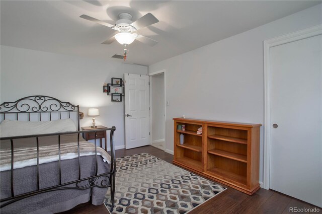 bedroom featuring ceiling fan and dark hardwood / wood-style floors