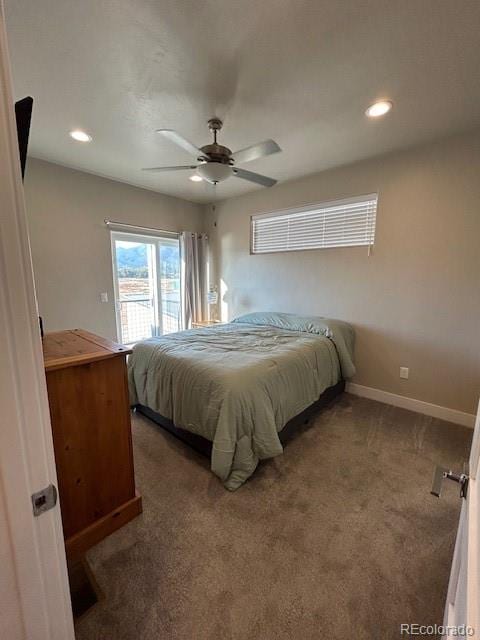 bedroom with ceiling fan and carpet floors