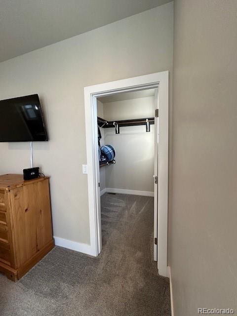 interior space featuring dark colored carpet