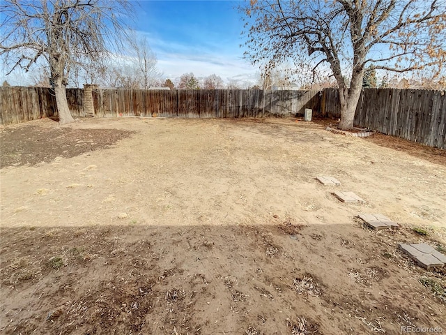 view of yard with a fenced backyard