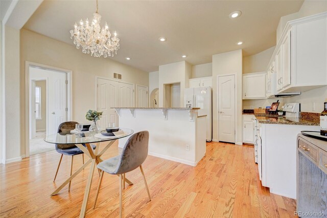 2061 Cheyenne Summer Vw, Colorado Springs, CO 80904 - dining space with light wood-style floors, recessed lighting, a chandelier, and baseboards