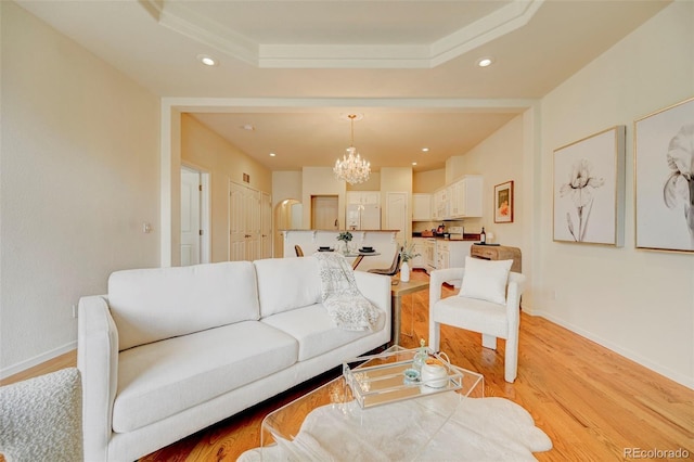 2061 Cheyenne Summer Vw, Colorado Springs, CO 80904 - living area with a chandelier, light wood-style floors, recessed lighting, baseboards, and a raised ceiling