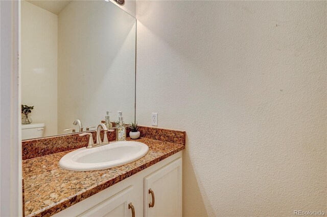 2061 Cheyenne Summer Vw, Colorado Springs, CO 80904 - half bathroom featuring vanity and toilet