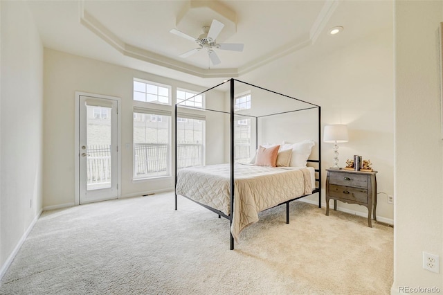 2061 Cheyenne Summer Vw, Colorado Springs, CO 80904 - bedroom featuring a tray ceiling, carpet flooring, access to exterior, baseboards, and ornamental molding