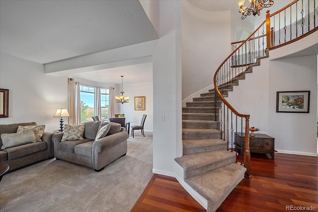 living room with an inviting chandelier and wood-type flooring