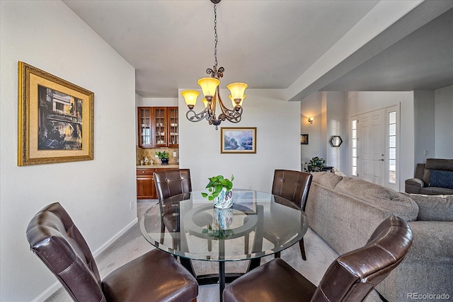 dining room featuring an inviting chandelier and wood-type flooring