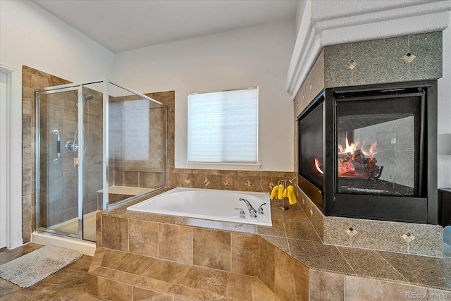 bathroom featuring separate shower and tub, a multi sided fireplace, and tile patterned floors