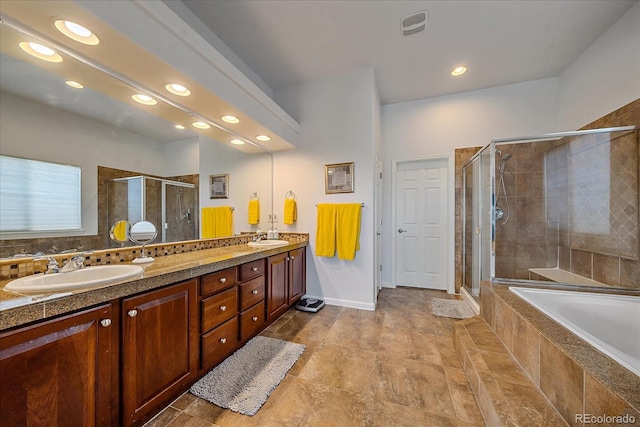 bathroom featuring independent shower and bath and vanity