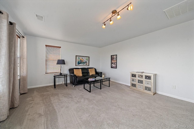 sitting room with light colored carpet