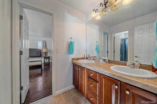 bathroom featuring hardwood / wood-style flooring and vanity