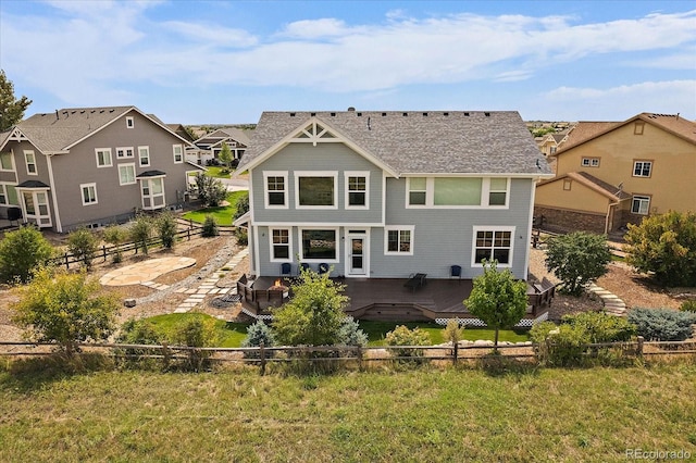 back of house featuring a patio area and a yard