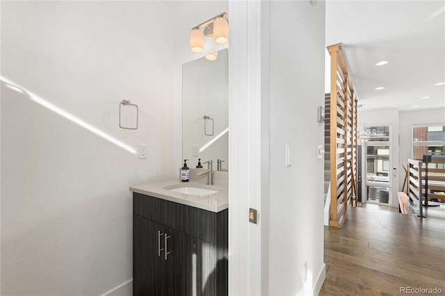 bathroom featuring wood-type flooring and vanity