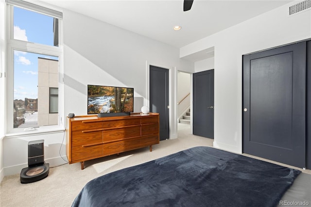 carpeted bedroom with ceiling fan