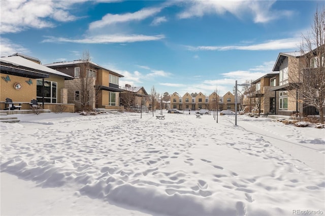 view of yard layered in snow