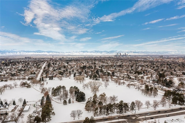 snowy aerial view with a mountain view