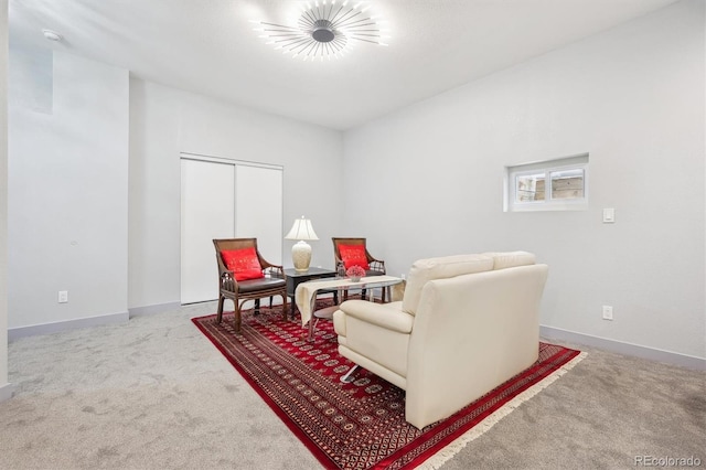 sitting room with carpet flooring and baseboards
