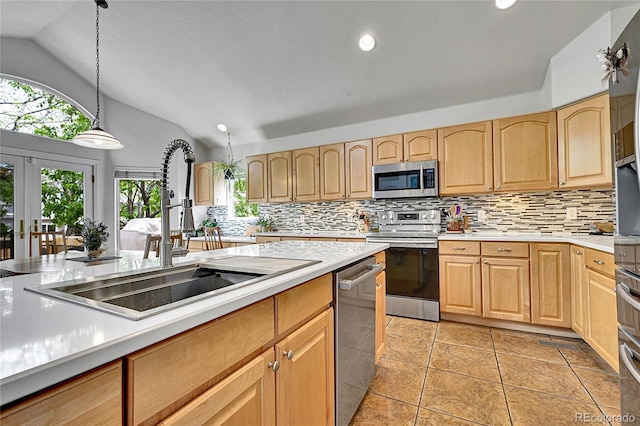 10653 W Parkhill Dr, Littleton, CO 80127 - kitchen with appliances with stainless steel finishes, a sink, lofted ceiling, light countertops, and light brown cabinets