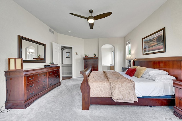 10653 W Parkhill Dr, Littleton, CO 80127 - bedroom with arched walkways, carpet floors, ceiling fan, and ensuite bath