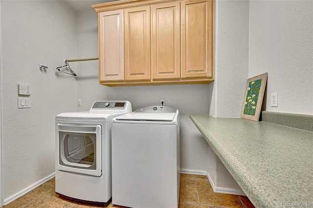 10653 W Parkhill Dr, Littleton, CO 80127 - clothes washing area featuring cabinet space, baseboards, separate washer and dryer, and tile patterned floors