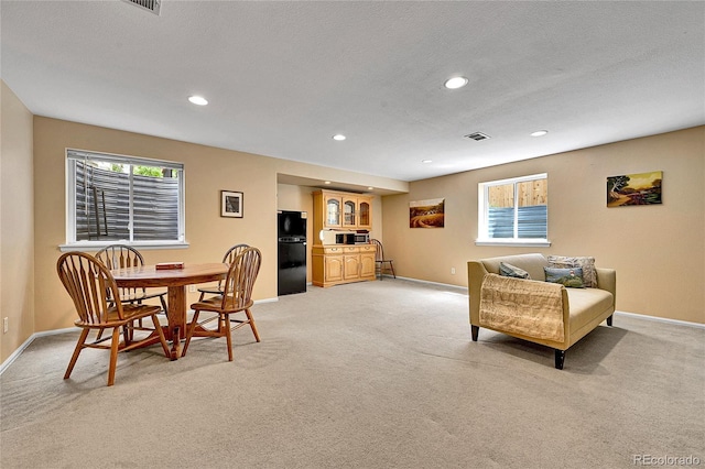 10653 W Parkhill Dr, Littleton, CO 80127 - living area with light colored carpet, baseboards, recessed lighting, and plenty of natural light