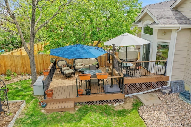 10653 W Parkhill Dr, Littleton, CO 80127 - deck featuring a fenced backyard and an outdoor living space