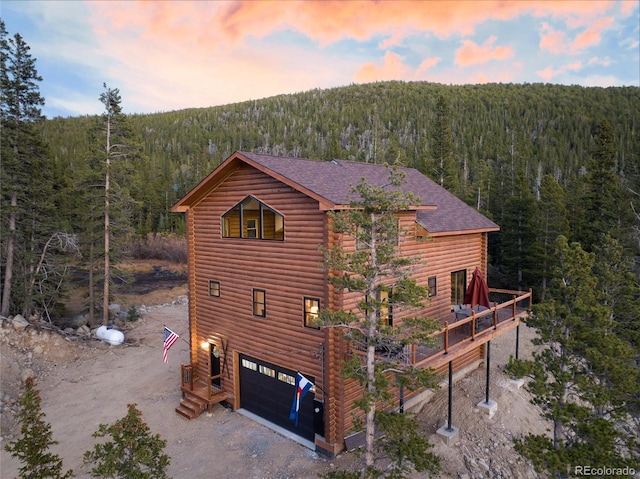 property exterior at dusk with a garage