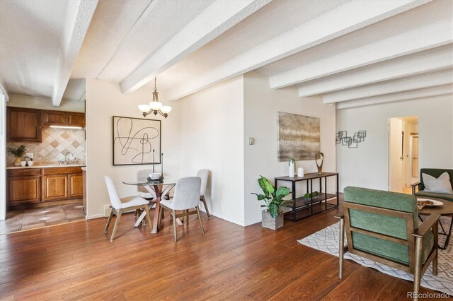 4801 E 9th Ave Unit 402S, Denver, CO 80220 - dining area featuring beamed ceiling, light wood-style flooring, a chandelier, and baseboards