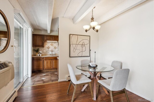 4801 E 9th Ave Unit 402S, Denver, CO 80220 - dining room with a baseboard radiator, beam ceiling, dark wood-style floors, a baseboard heating unit, and a chandelier