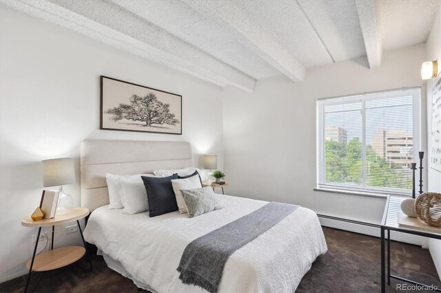 4801 E 9th Ave Unit 402S, Denver, CO 80220 - carpeted bedroom featuring beamed ceiling and a textured ceiling