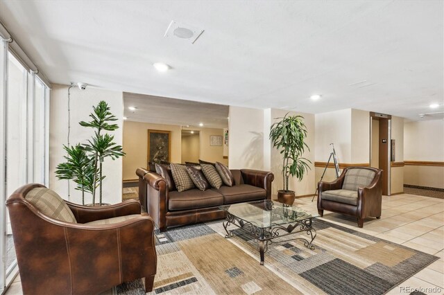 4801 E 9th Ave Unit 402S, Denver, CO 80220 - living room featuring light tile patterned flooring, recessed lighting, and baseboards