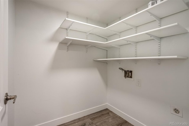 laundry area featuring hardwood / wood-style flooring, hookup for an electric dryer, and hookup for a washing machine