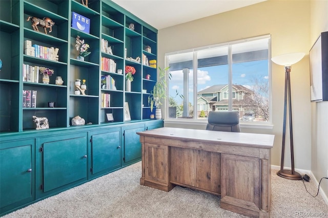 home office featuring light colored carpet and baseboards